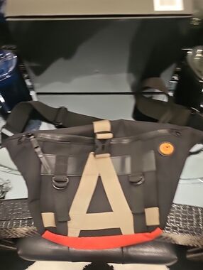 Joan & David Black Sling Bag with Tan Straps and Red Accent